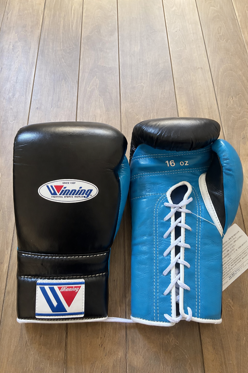 Winning Boxing Gloves Black/Blue Curved Leather Gloves for MMA Training