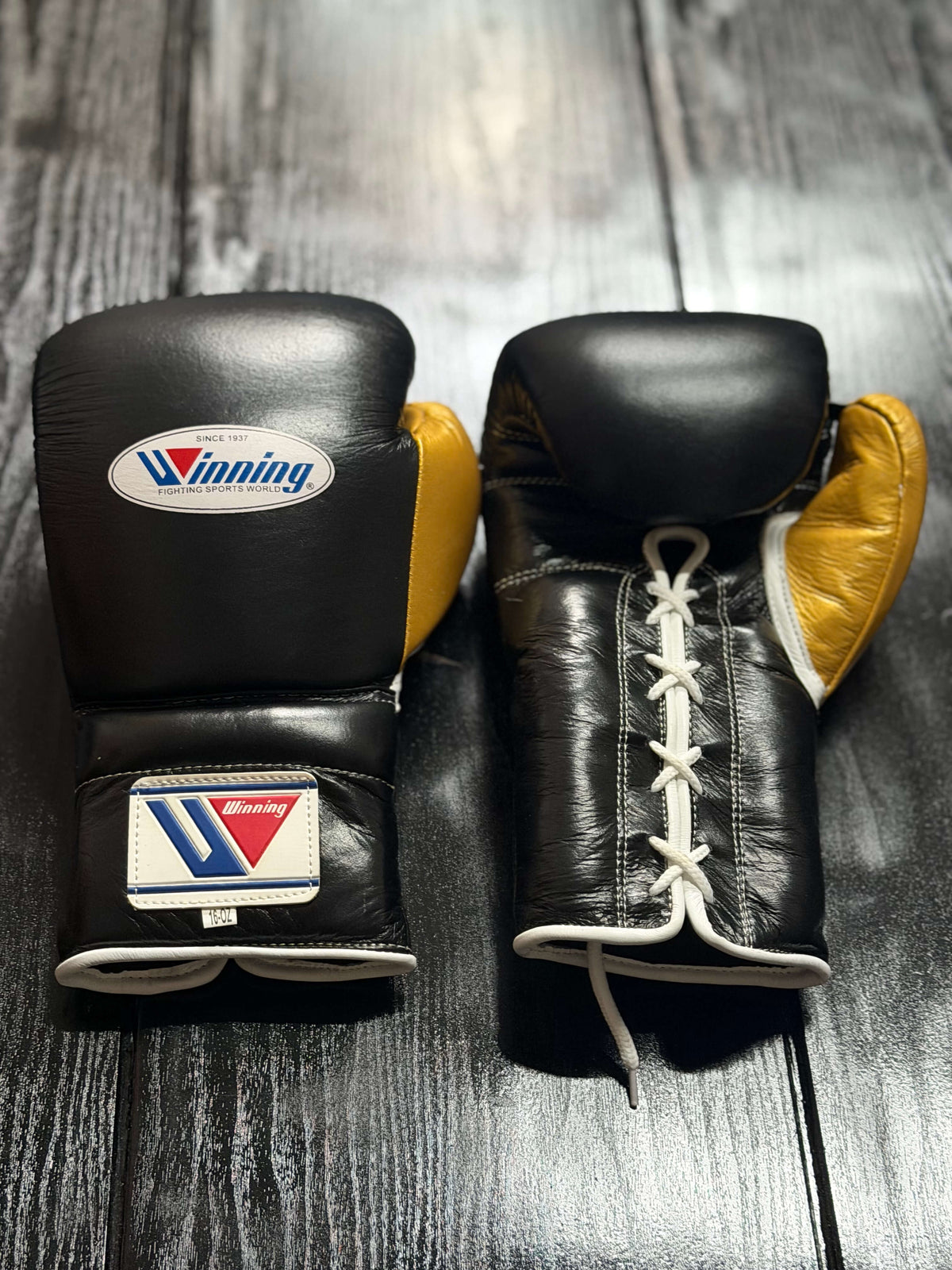 Winning Boxing Gloves Black/Gold Leather Training Gloves Front View