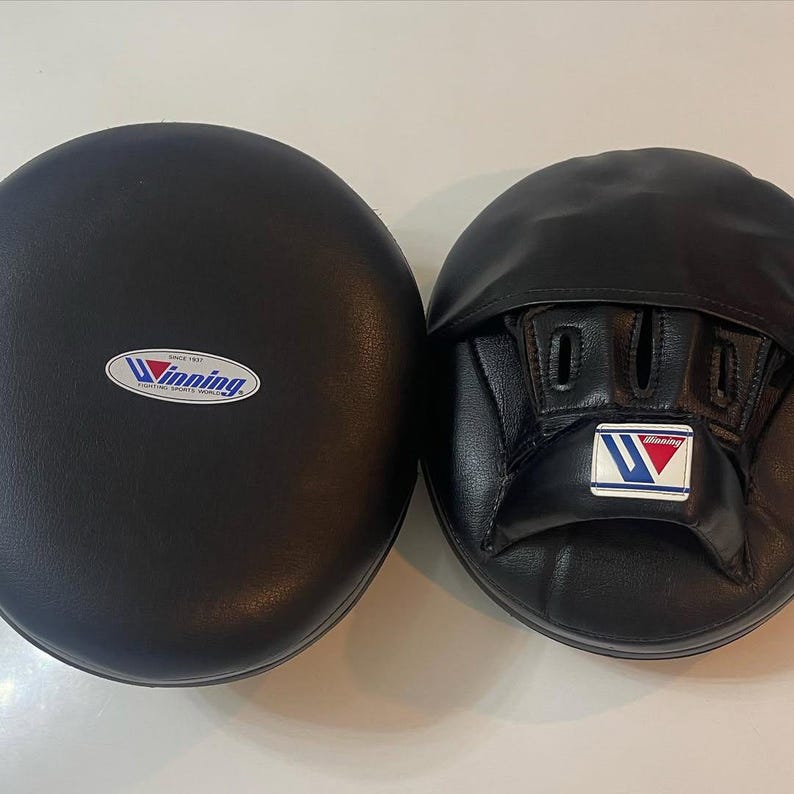 winning style punching mitts, boxing punching mitts, boxing focus mitts, professional focus mitts, training focus mitts, pro style focus mitts, coach boxing mitts, trainer focus mitts, premium punching mitts, leather focus mitts, cowhide focus mitts, top grain leather mitts, handmade focus mitts, stitched punching mitts, durable focus mitts, lightweight focus mitts, high density foam mitts, multi layer padding mitts, shock absorbing mitts, impact absorbing mitts, curved focus mitts, flat focus mitts, compac