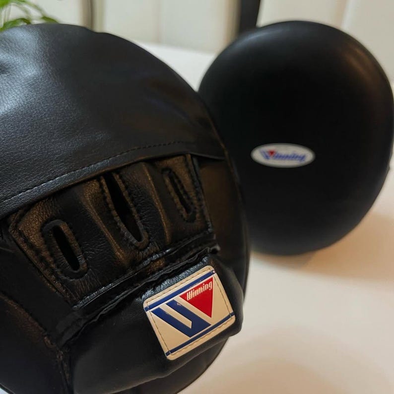 winning style punching mitts, boxing punching mitts, boxing focus mitts, professional focus mitts, training focus mitts, pro style focus mitts, coach boxing mitts, trainer focus mitts, premium punching mitts, leather focus mitts, cowhide focus mitts, top grain leather mitts, handmade focus mitts, stitched punching mitts, durable focus mitts, lightweight focus mitts, high density foam mitts, multi layer padding mitts, shock absorbing mitts, impact absorbing mitts, curved focus mitts, flat focus mitts,