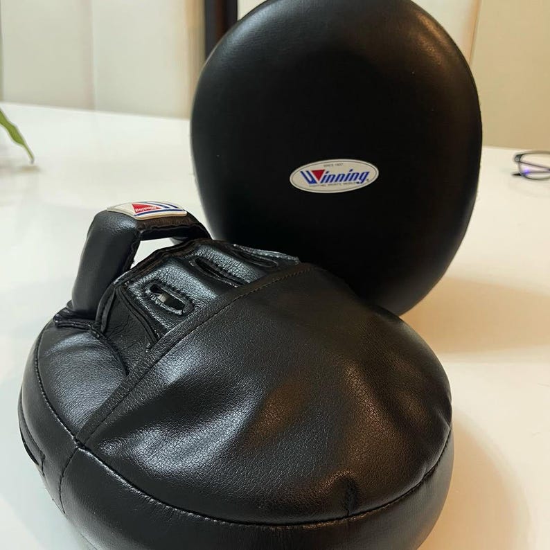 winning style punching mitts, boxing punching mitts, boxing focus mitts, professional focus mitts, training focus mitts, pro style focus mitts, coach boxing mitts, trainer focus mitts, premium punching mitts, leather focus mitts, cowhide focus mitts, top grain leather mitts, handmade focus mitts, stitched punching mitts, durable focus mitts, lightweight focus mitts, high density foam mitts, multi layer padding mitts, shock absorbing mitts, impact absorbing mitts, curved focus mitts, flat focus mitts, 